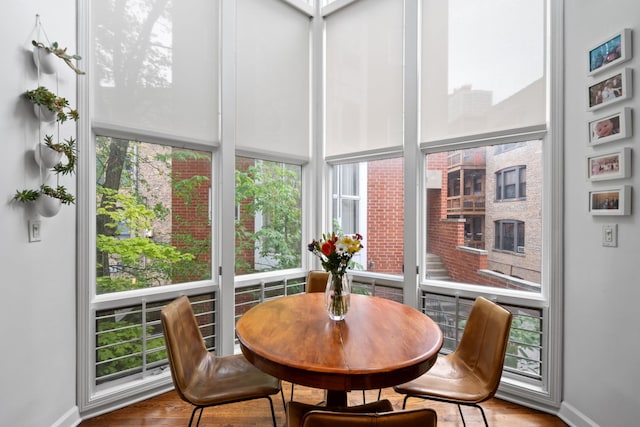 5510 S Cornell Ave Unit E, Chicago, IL 60637 - sunroom featuring healthy amount of natural light, baseboards, and wood finished floors