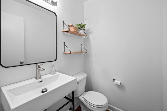 5510 S Cornell Ave Unit E, Chicago, IL 60637 - half bath with toilet, baseboards, and vanity