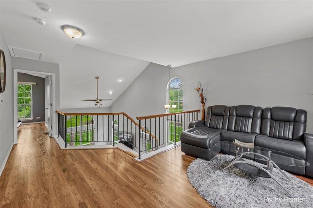 184 Golfview Dr, Glendale Heights, IL 60139 - living room with wood finished floors, healthy amount of natural light, vaulted ceiling, and ceiling fan