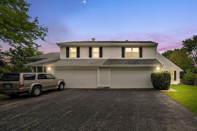 1553 Brandywyn Ct N, Buffalo Grove, IL 60089 - view of front facade with asphalt driveway and a garage