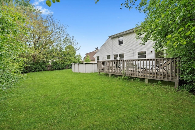 1553 Brandywyn Ct N, Buffalo Grove, IL 60089 - view of grassy yard featuring a wooden deck and an outdoor pool
