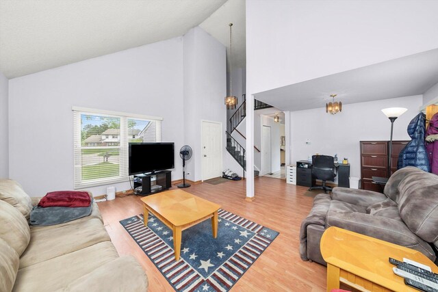 1553 Brandywyn Ct N, Buffalo Grove, IL 60089 - living room with high vaulted ceiling, stairs, and wood finished floors