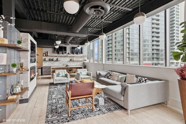 660 W Wayman St Unit 701, Chicago, IL 60661 - living area featuring hardwood / wood-style flooring and a glass covered fireplace