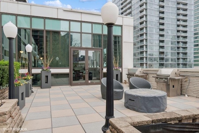 660 W Wayman St Unit 701, Chicago, IL 60661 - view of patio / terrace featuring french doors and grilling area