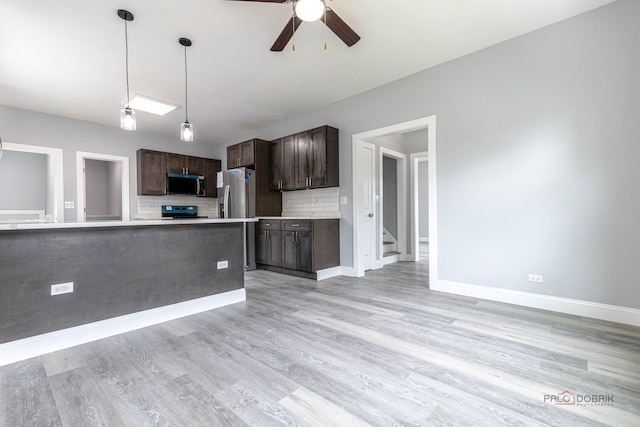 196 Southgate Ave, Chicago Heights, IL 60411 - kitchen with appliances with stainless steel finishes, dark brown cabinetry, ceiling fan, tasteful backsplash, and light countertops