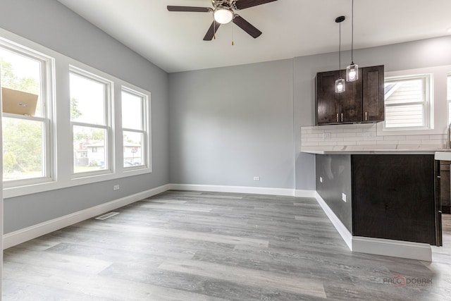 196 Southgate Ave, Chicago Heights, IL 60411 - unfurnished living room featuring a ceiling fan, healthy amount of natural light, and light wood finished floors