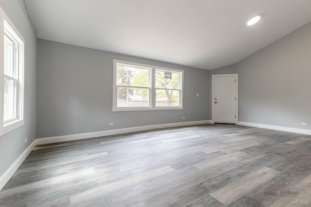 196 Southgate Ave, Chicago Heights, IL 60411 - spare room featuring wood finished floors, vaulted ceiling, and baseboards