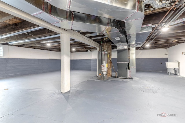 196 Southgate Ave, Chicago Heights, IL 60411 - unfinished below grade area featuring water heater, heating unit, and a sink