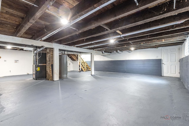 196 Southgate Ave, Chicago Heights, IL 60411 - below grade area featuring water heater, heating unit, and stairs