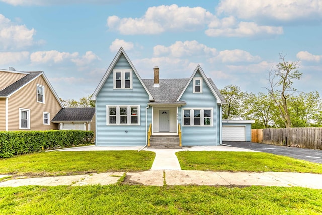 196 Southgate Ave, Chicago Heights, IL 60411 - view of front facade featuring a chimney, a garage, and roof with shingles