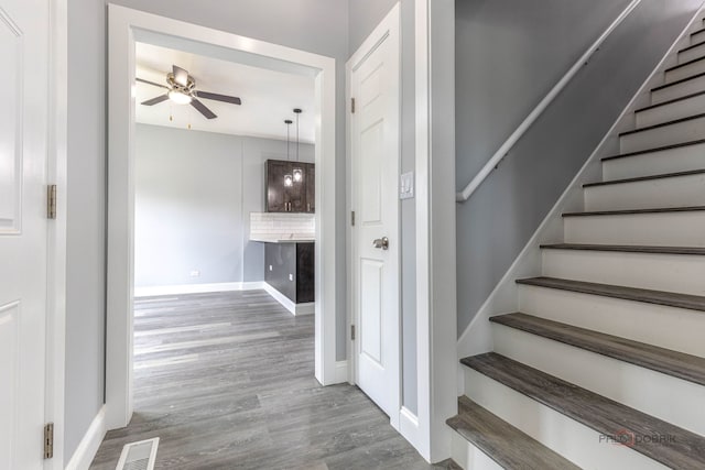 196 Southgate Ave, Chicago Heights, IL 60411 - stairway with ceiling fan, wood finished floors, and baseboards
