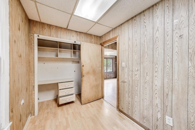 7649 S Dobson Ave, Chicago, IL 60619 - unfurnished office featuring a drop ceiling, wood finished floors, and wooden walls