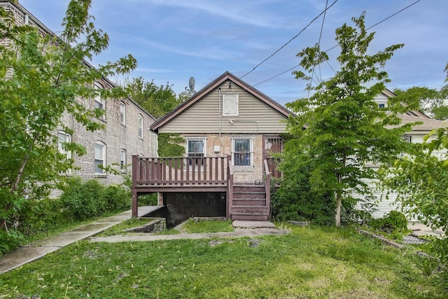 7649 S Dobson Ave, Chicago, IL 60619 - back of house with a wooden deck and a yard