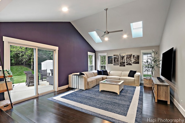 1116 Stonegate Ct, Bartlett, IL 60103 - living room with a skylight, healthy amount of natural light, dark wood finished floors, a ceiling fan, and high vaulted ceiling