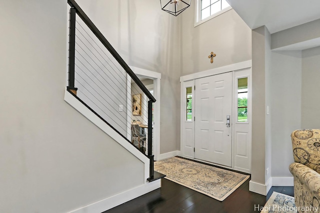 1116 Stonegate Ct, Bartlett, IL 60103 - entrance foyer featuring baseboards, a high ceiling, wood finished floors, and stairway