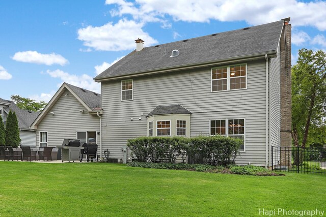 1116 Stonegate Ct, Bartlett, IL 60103 - rear view of house with a chimney and a patio area