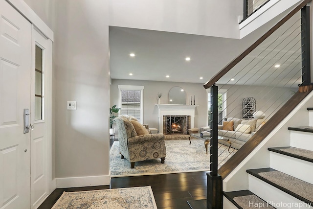 1116 Stonegate Ct, Bartlett, IL 60103 - living room featuring dark wood finished floors, stairs, a brick fireplace, baseboards, and recessed lighting