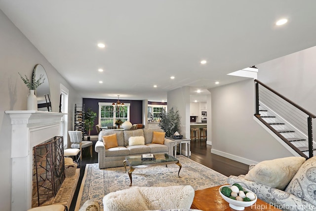 1116 Stonegate Ct, Bartlett, IL 60103 - living room featuring recessed lighting, stairway, dark wood-style floors, baseboards, and a fireplace with raised hearth