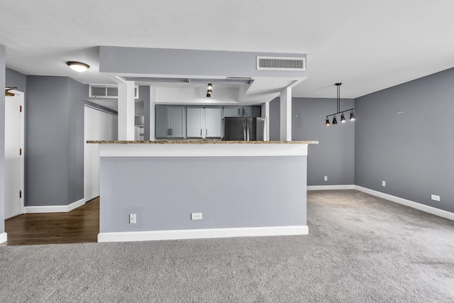 850 Wellington Ave Unit 515, Elk Grove Village, IL 60007 - kitchen with freestanding refrigerator, dark colored carpet, baseboards, and gray cabinetry
