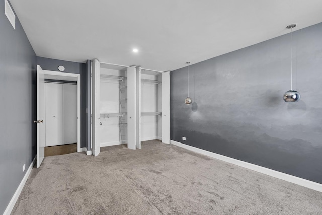 850 Wellington Ave Unit 515, Elk Grove Village, IL 60007 - unfurnished bedroom with carpet, two closets, and baseboards
