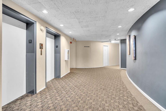 850 Wellington Ave Unit 515, Elk Grove Village, IL 60007 - hallway featuring elevator, recessed lighting, and baseboards
