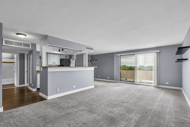 850 Wellington Ave Unit 515, Elk Grove Village, IL 60007 - unfurnished living room with carpet floors and baseboards