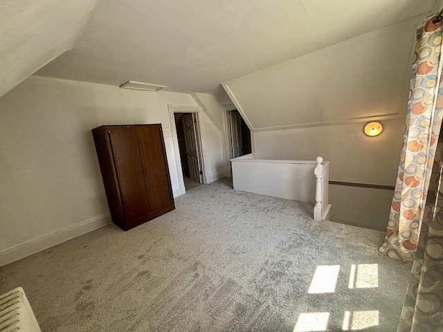 418 Starr St, Belvidere, IL 61008 - bonus room with carpet floors, vaulted ceiling, and baseboards