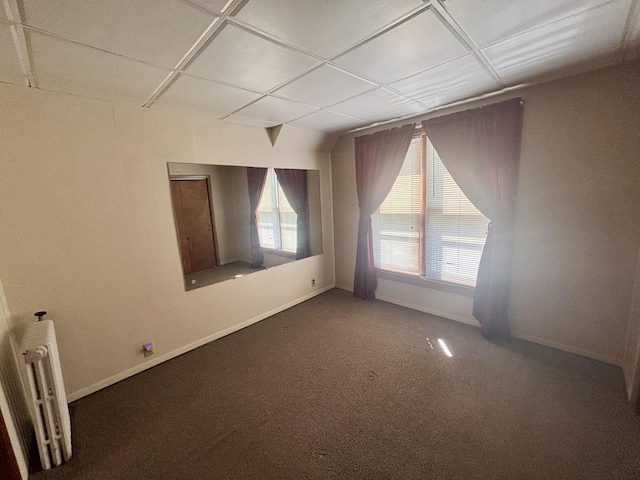 418 Starr St, Belvidere, IL 61008 - unfurnished room with radiator heating unit, carpet, and baseboards