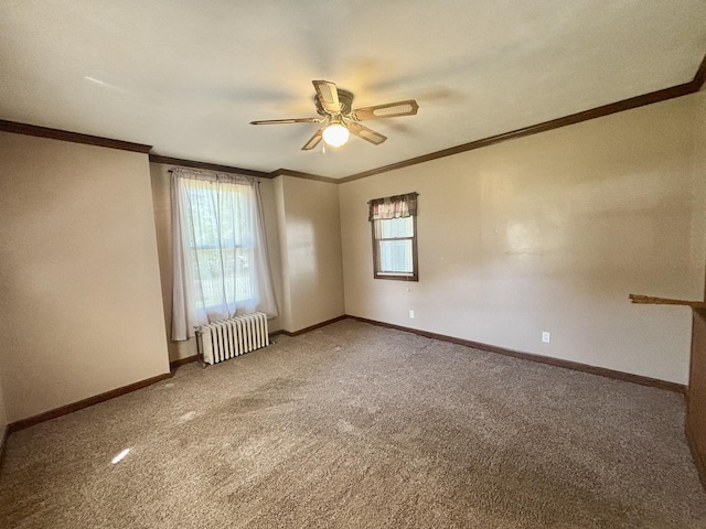 418 Starr St, Belvidere, IL 61008 - spare room featuring radiator heating unit, ornamental molding, ceiling fan, carpet floors, and baseboards