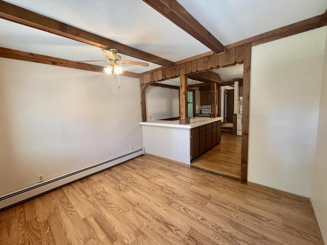 418 Starr St, Belvidere, IL 61008 - unfurnished living room featuring a baseboard radiator, beamed ceiling, light wood-style flooring, and a ceiling fan