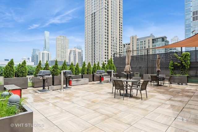 345 N Lasalle Dr Unit 802, Chicago, IL 60610 - view of patio featuring a skyline view and area for grilling