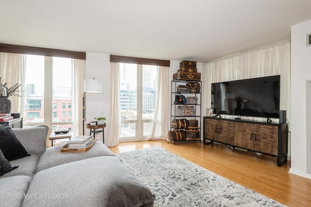 345 N Lasalle Dr Unit 802, Chicago, IL 60610 - living room with light wood-style floors and plenty of natural light