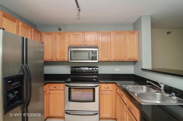 345 N Lasalle Dr Unit 802, Chicago, IL 60610 - kitchen featuring stainless steel appliances, a sink, dark countertops, and light brown cabinets
