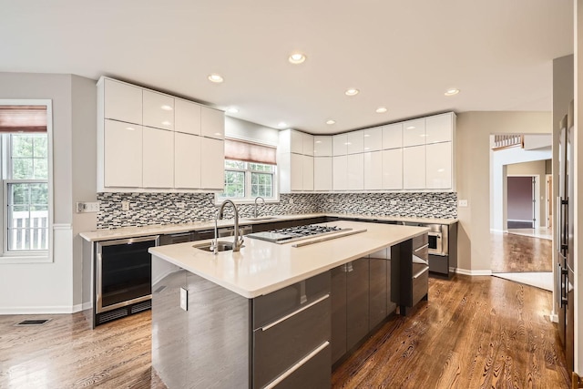 830 W Lukas Ave, Palatine, IL 60067 - kitchen featuring wine cooler, modern cabinets, white gas cooktop, a sink, and recessed lighting