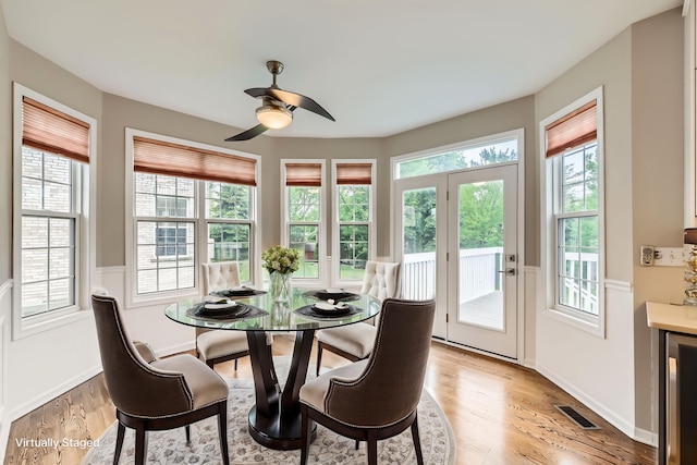 830 W Lukas Ave, Palatine, IL 60067 - dining area featuring healthy amount of natural light, light wood finished floors, beverage cooler, and a ceiling fan