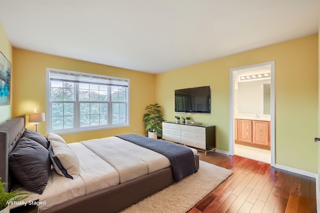 830 W Lukas Ave, Palatine, IL 60067 - bedroom featuring wood finished floors, baseboards, and connected bathroom