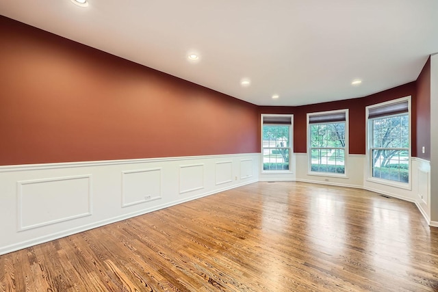 830 W Lukas Ave, Palatine, IL 60067 - empty room featuring wood finished floors, a wainscoted wall, and recessed lighting