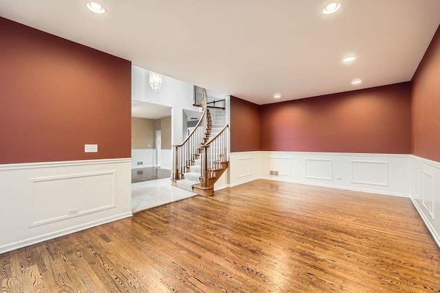 830 W Lukas Ave, Palatine, IL 60067 - empty room with a wainscoted wall, wood finished floors, stairway, a decorative wall, and recessed lighting