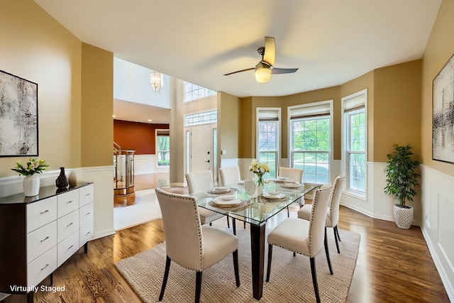 830 W Lukas Ave, Palatine, IL 60067 - dining area with dark wood finished floors, a wainscoted wall, and a ceiling fan