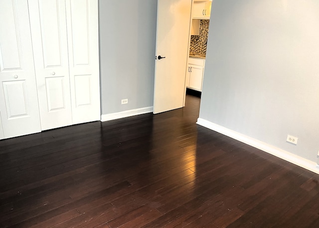 430 Walnut Ave Unit 2201, Lisle, IL 60532 - unfurnished bedroom with baseboards and dark wood-type flooring