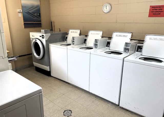 430 Walnut Ave Unit 2201, Lisle, IL 60532 - community laundry room featuring washing machine and clothes dryer and concrete block wall