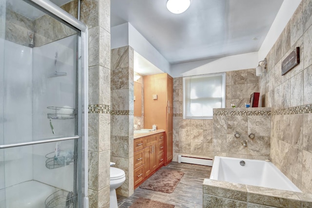 12599 S Archer Ave, Lemont, IL 60439 - full bathroom featuring baseboard heating, tile walls, vanity, a garden tub, and a stall shower