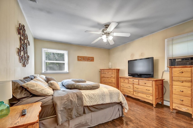12599 S Archer Ave, Lemont, IL 60439 - bedroom with wood finished floors, a baseboard radiator, and a ceiling fan