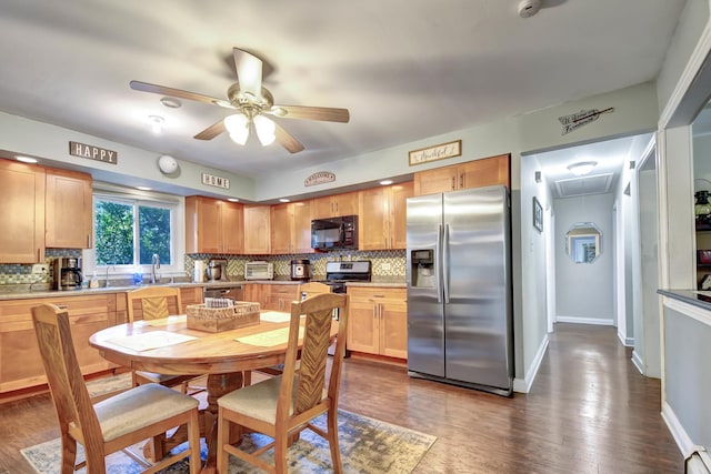 12599 S Archer Ave, Lemont, IL 60439 - kitchen featuring appliances with stainless steel finishes, a ceiling fan, decorative backsplash, a sink, and dark wood finished floors