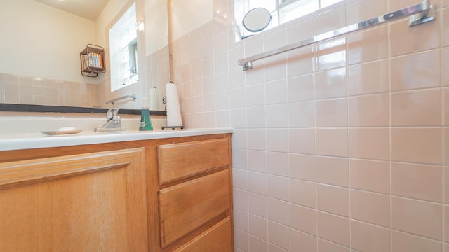 13122 S Escanaba Ave, Chicago, IL 60633 - bathroom with tile walls, vanity, and decorative backsplash