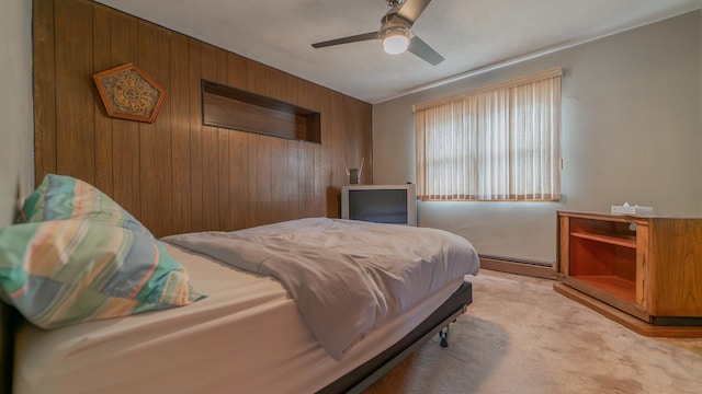 13122 S Escanaba Ave, Chicago, IL 60633 - bedroom with a baseboard heating unit, wooden walls, light carpet, and a ceiling fan