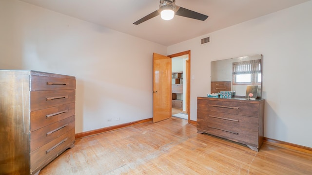 13122 S Escanaba Ave, Chicago, IL 60633 - bedroom with light wood-style flooring, baseboards, and a ceiling fan