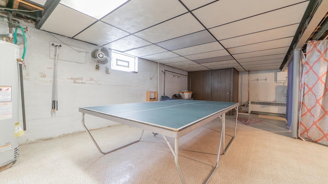 13122 S Escanaba Ave, Chicago, IL 60633 - rec room with radiator, water heater, and a paneled ceiling