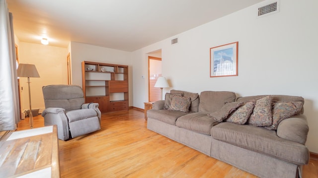 13122 S Escanaba Ave, Chicago, IL 60633 - living room featuring wood finished floors
