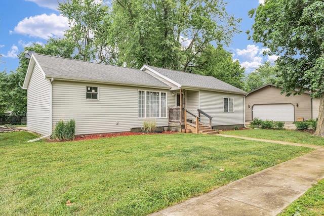 318 W Market St, Farmer City, IL 61842 - ranch-style home featuring a front lawn, a detached garage, a shingled roof, and an outdoor structure